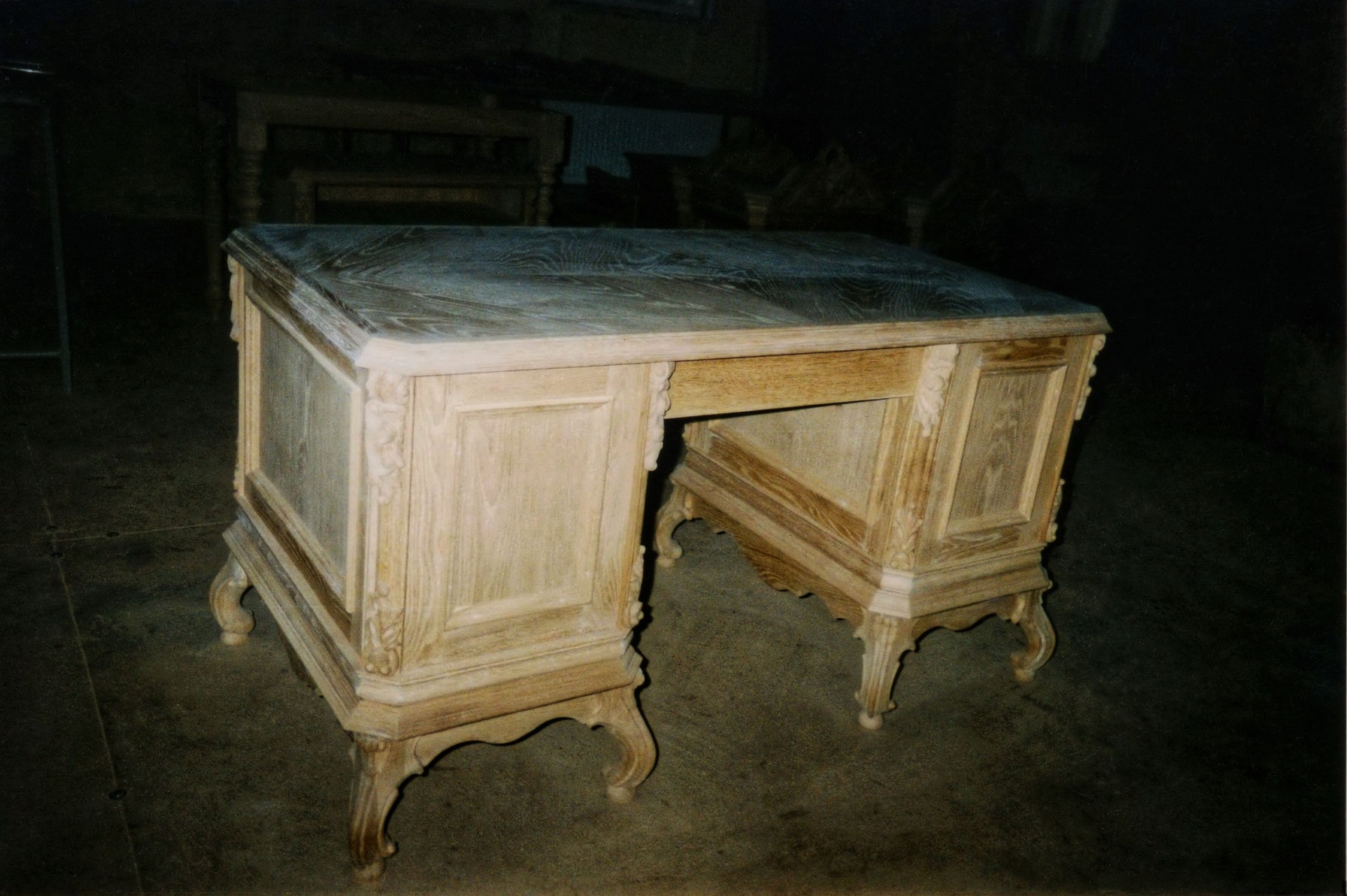 A handcrafted wooden desk in a workshop