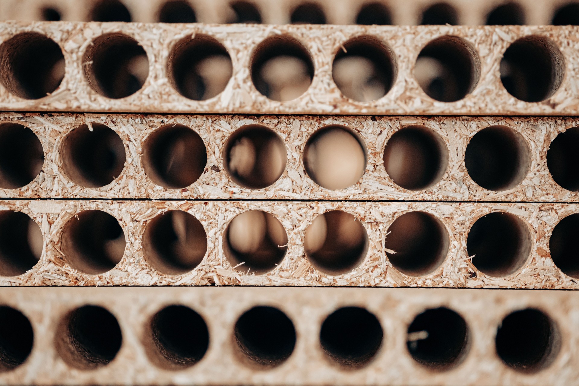 Perforated Particle Boards Stacked for Furniture Construction